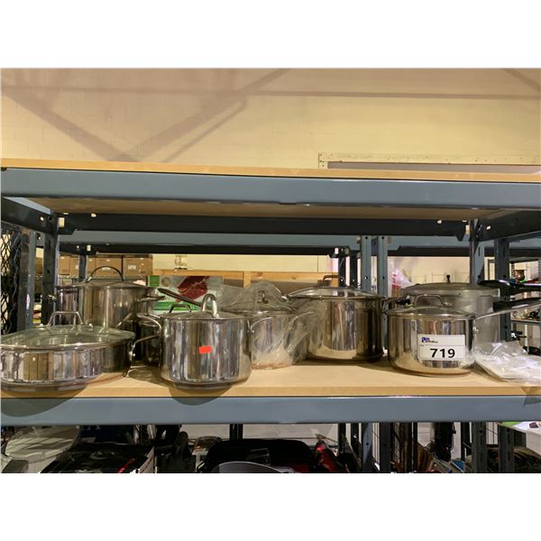 SHELF OF EMERIL POTS AND PRESSURE COOKER