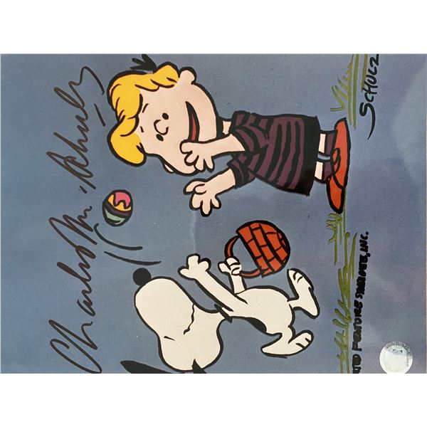 Peanuts Charles Schulz signed photo. GFA Authenticated