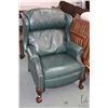 Image 1 : Green leather upholstered Chippendale style wing back recliner with nail head decoration and carved 