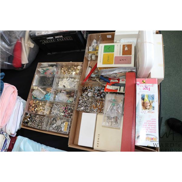 Two large trays of fasteners, gromets, buttons, beads, sewing machine accessories, Singer Monogramer