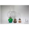 Image 1 : Three vintage oil lamps including one finger lamp, one with homemade wire hanging wire and a green f