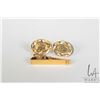 Image 1 : Pair of 14kt yellow gold cufflinks with Asian character design and a marked 14kt yellow gold tie cli