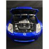 Image 8 : 2 1:18 Scale Maisto Collector Cars. Nissan & Mustang