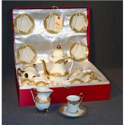 CASED GILT DECORATED PORCELAIN DEMITASSE SET