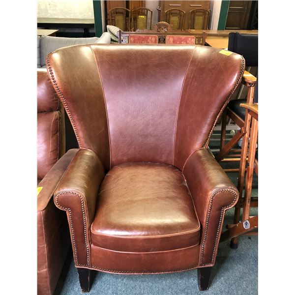 Leather studded oversized wingback chair