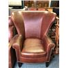 Image 1 : Leather studded oversized wingback chair