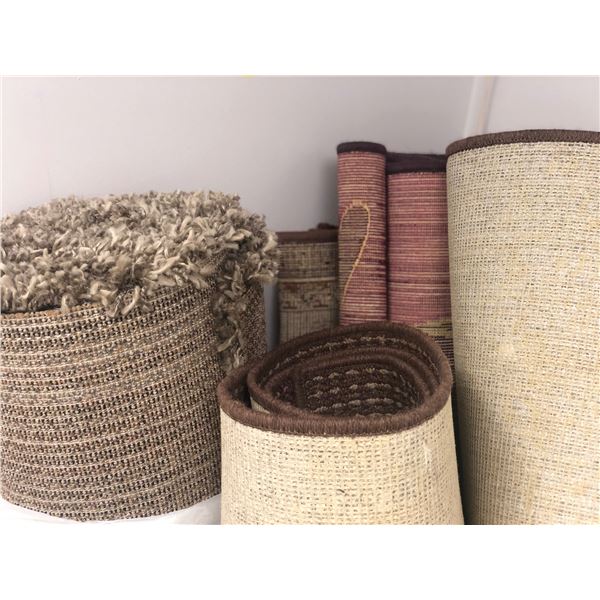 Large group of assorted rugs