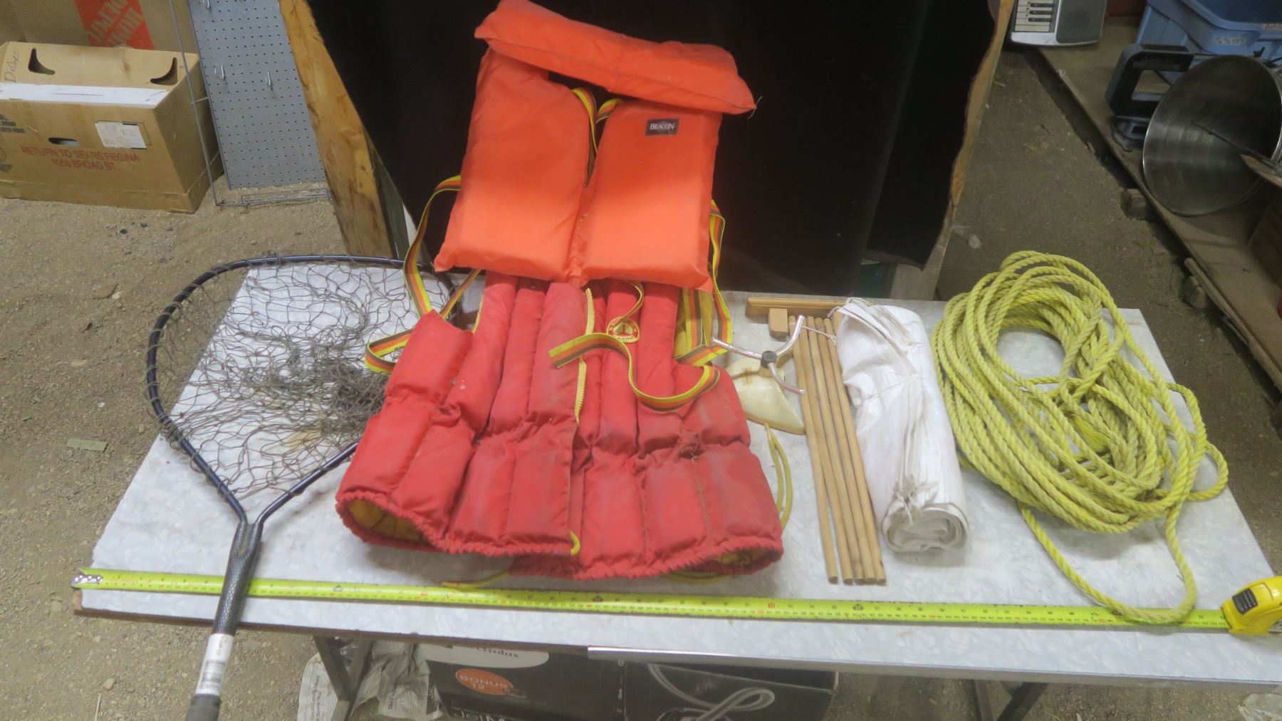 assorted lot - life jackets, fish net, rope, sprinkler, tarp, etc ...