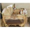 Image 1 : Green "Baby Trend" playpen, comes with bassinet, change table, shade, etc.