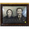 Image 1 : Old family portrait. Concave glass. Some wear and tear on frame.  16 in x 12 in.