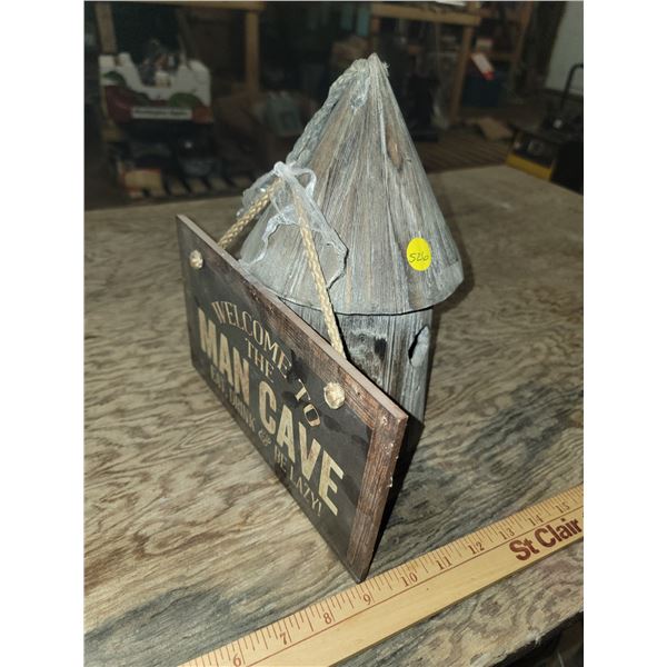 wooden bird house & man cave sign