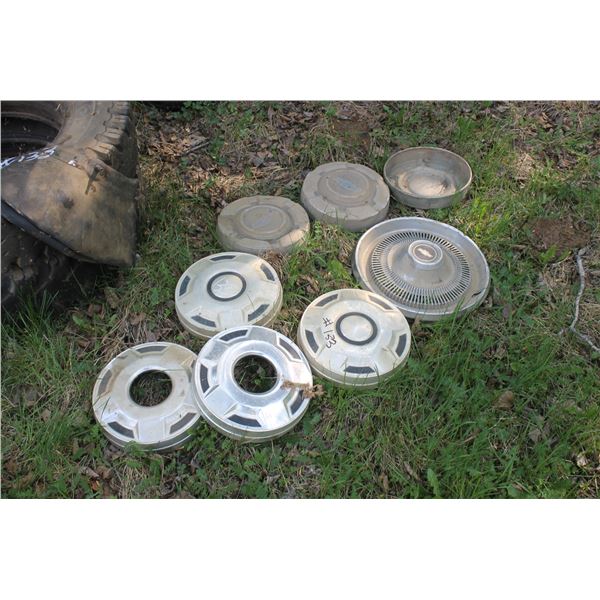 Approx. 8- Hub caps and 2- 700x18 tires