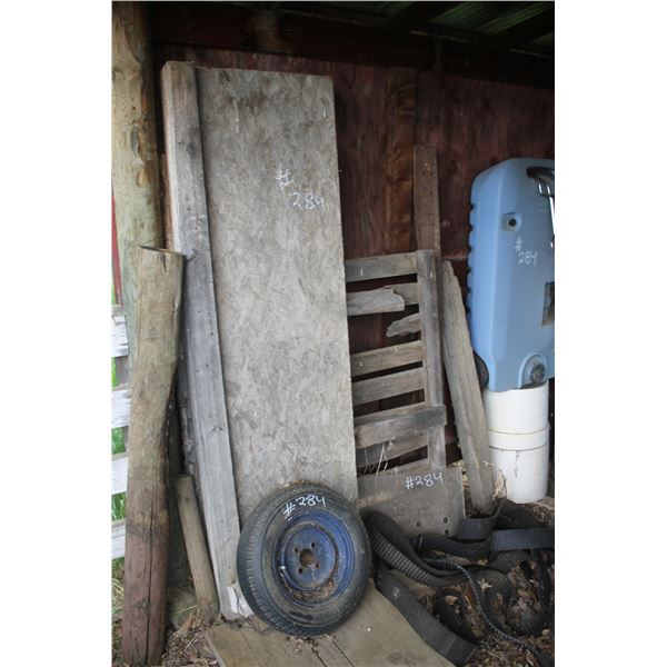 Misc. tires, barrel, blue water tank, white poly tank