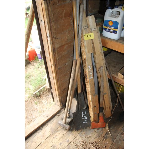 Inside the granary- Sledge hammers, axe, shovel, misc. wood