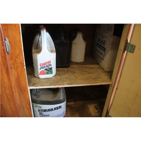 Qty of oils in and under brown cabinet