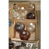 Image 2 : Glass gallon bottles and insulators.
