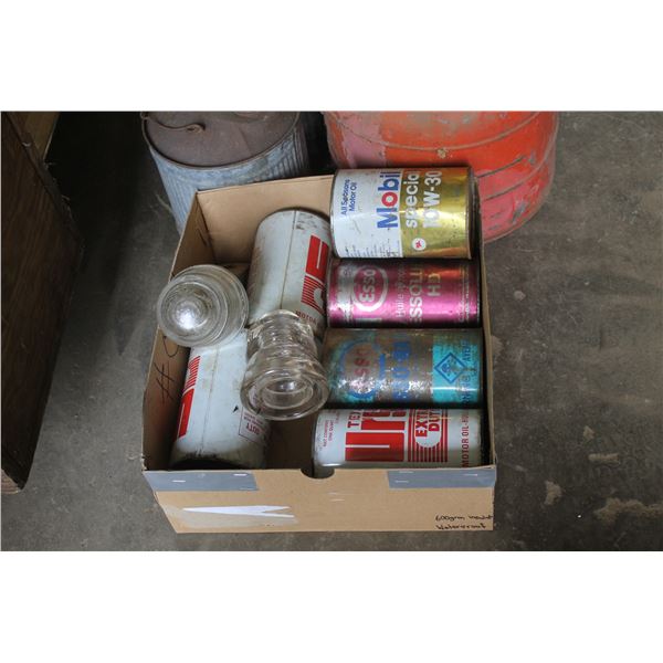 Old gas cans (3), 6 full quarts of oil, chicken waterer and glass insulators.