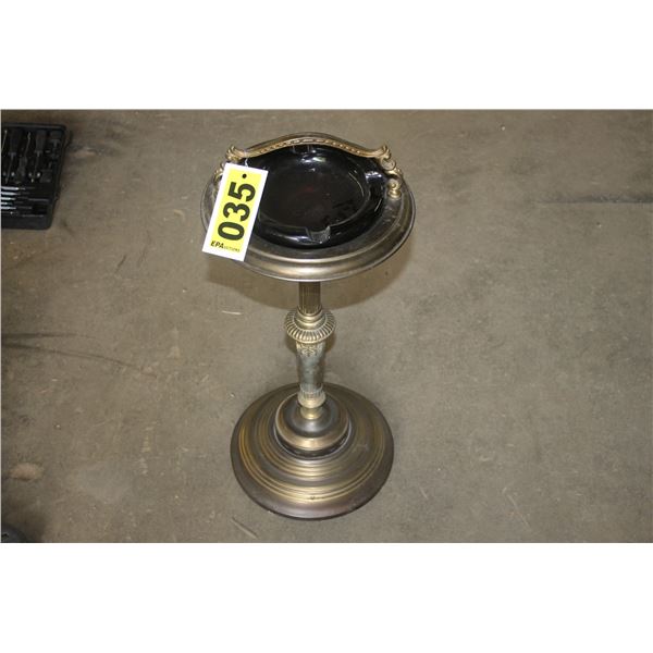 Old standing ashtray.