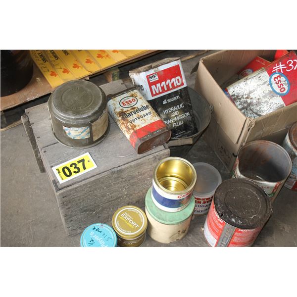 Egg crate, old bucket, 6 oil jugs square containers, tobacco cans, syrup can and grease cans.
