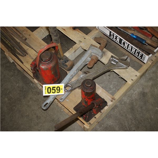 2 Hydraulic jacks, 2 pipe wrenches, crescent wrench and a 8lb sledge hammer.