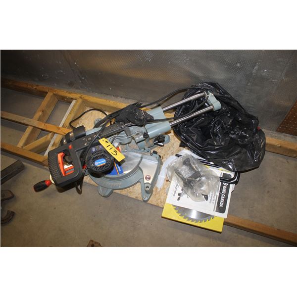 Compound mitre saw on wood frame with extra blade.
