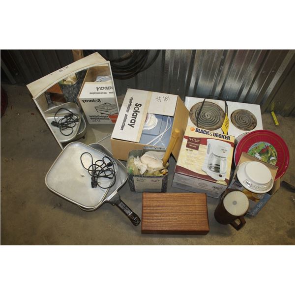 Medicine cabinet, old hot plate, coffee pot, weigh scale, chest with hole puncher and electric fryin