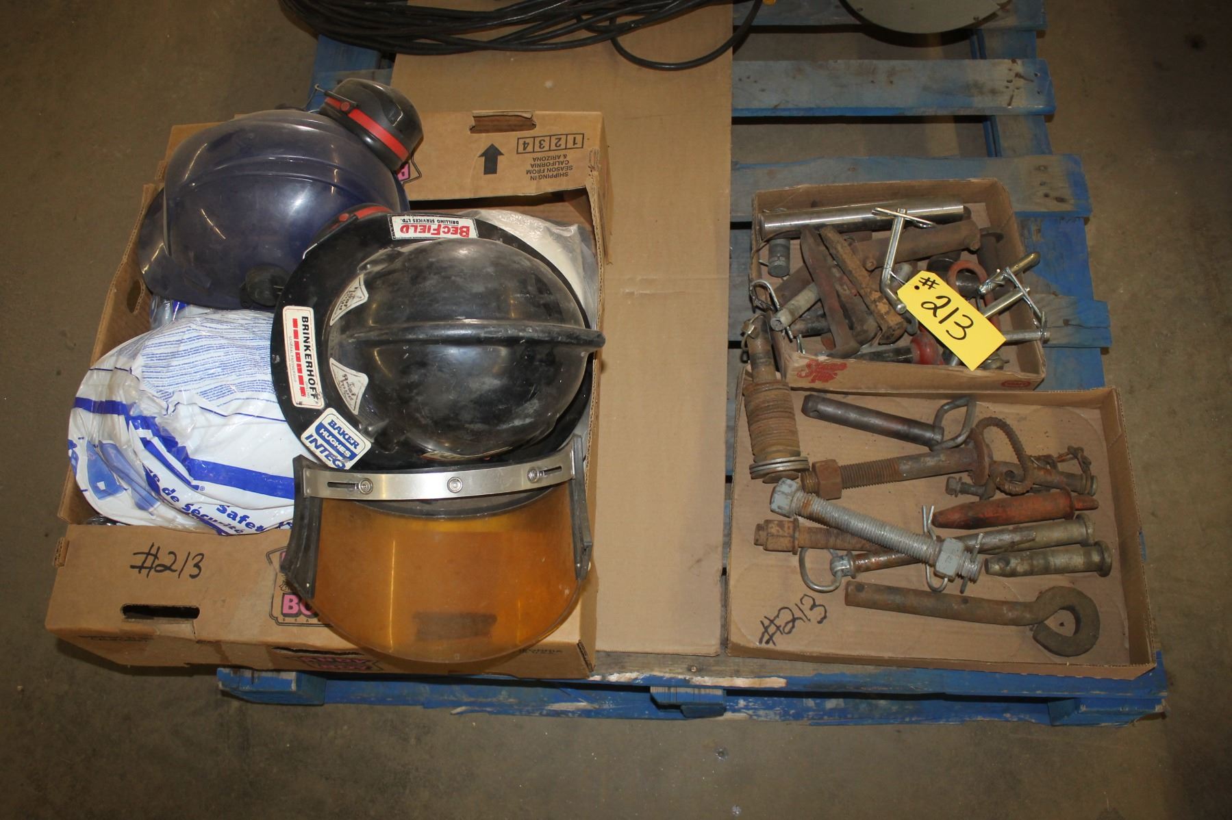 Pins, receiver pins and box of hard hats 1 with a face shield.