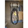 Image 1 : Bench grinder, manual fuel pump and extension cord.