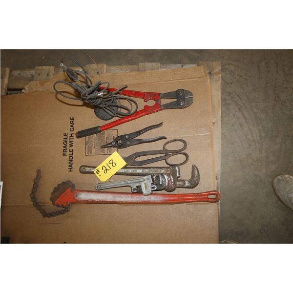 Bolt cutters, (2) tin snips, (2) pipe wrenches and chain wrench.