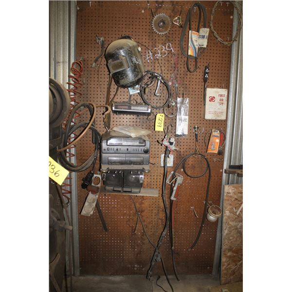 Welding shield, belts, old cd player, first aid kit, battery cables, air hose and more.