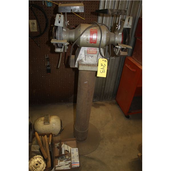 Bench grinder on stand.