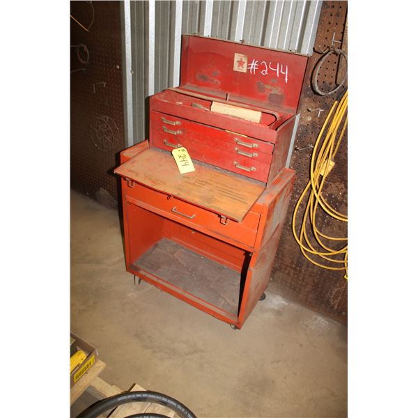 Small tool box (Beach), some files, some screws and some clamps inside. Top box is 11"H x 21"W x 9"D
