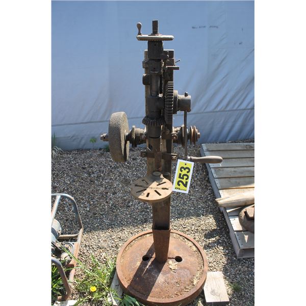 Post drill with grind stone