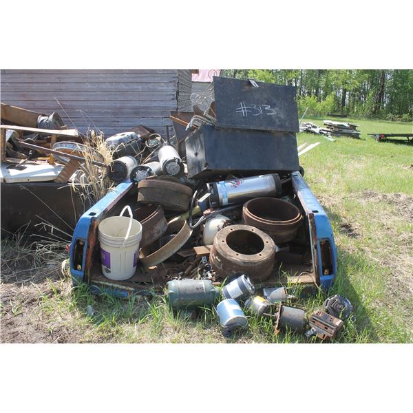 Blue truck box of scrap metal.