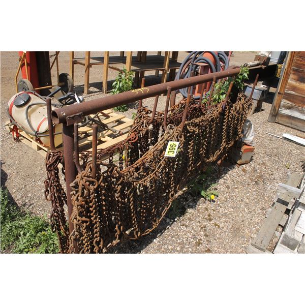 Tire chain rack (large) with 3 sets of chains, plus cross chains.