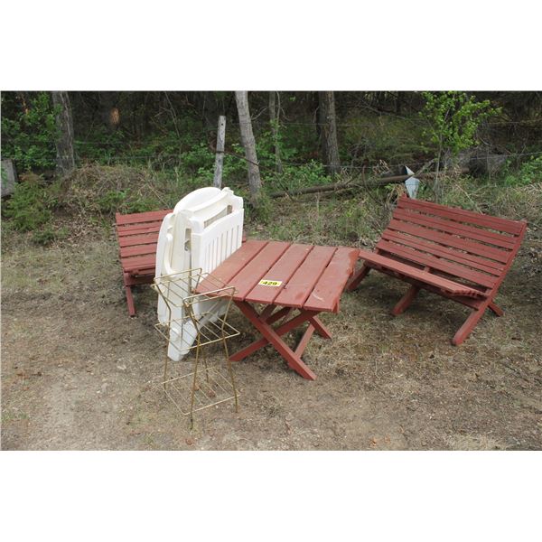 Lounger, wooden table and 2 chairs, and a plant stand.