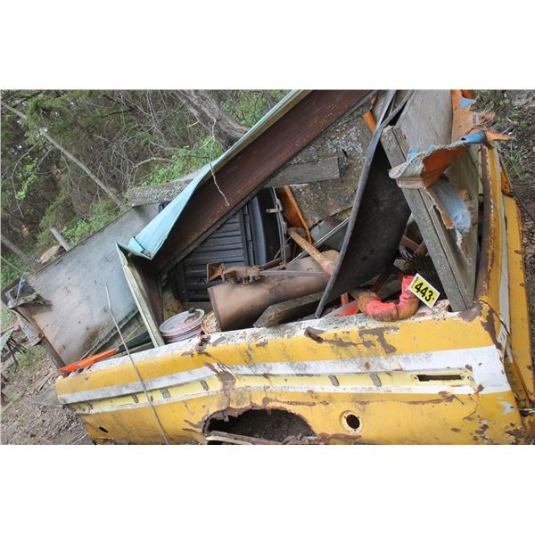 Yellow pickup box with scrap steel.