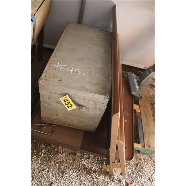 Metal bed frame, trunk, kitchen table.