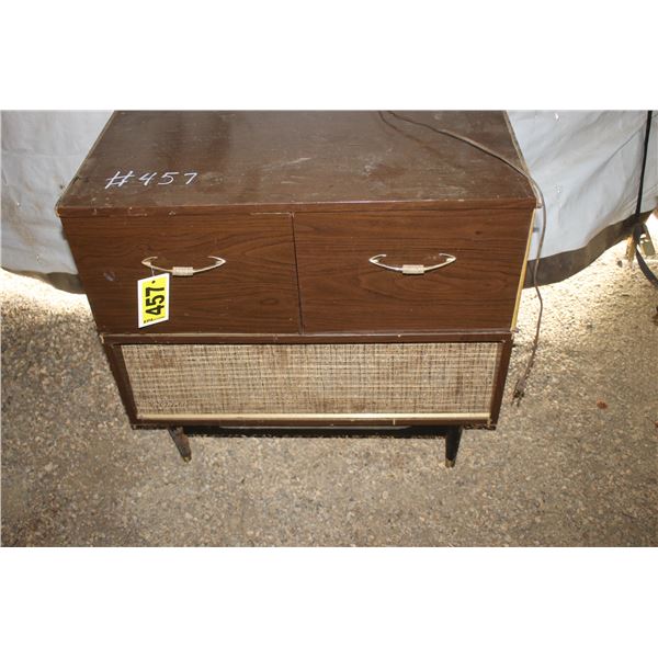 Cabinet stereo record player and radio.