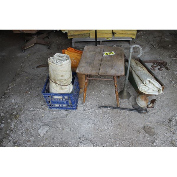 Wood table, coat rack, tarps and metal bar.