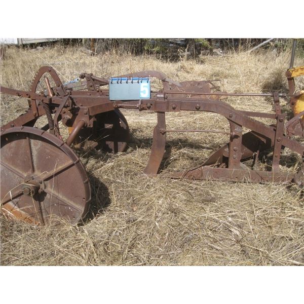 Antique pull behind plow