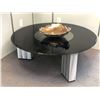 Image 1 : Black glass top round coffee table w/ decorative metal centerpiece - approx. 42in diameter x 15in ta