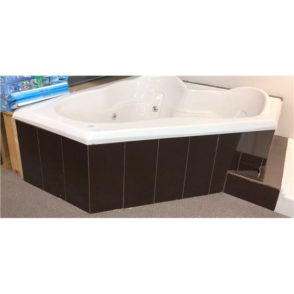 New contemporary corner jacuzzi tub (approx. 5ft x 59in W 22in H) (bidder responsible for removal)