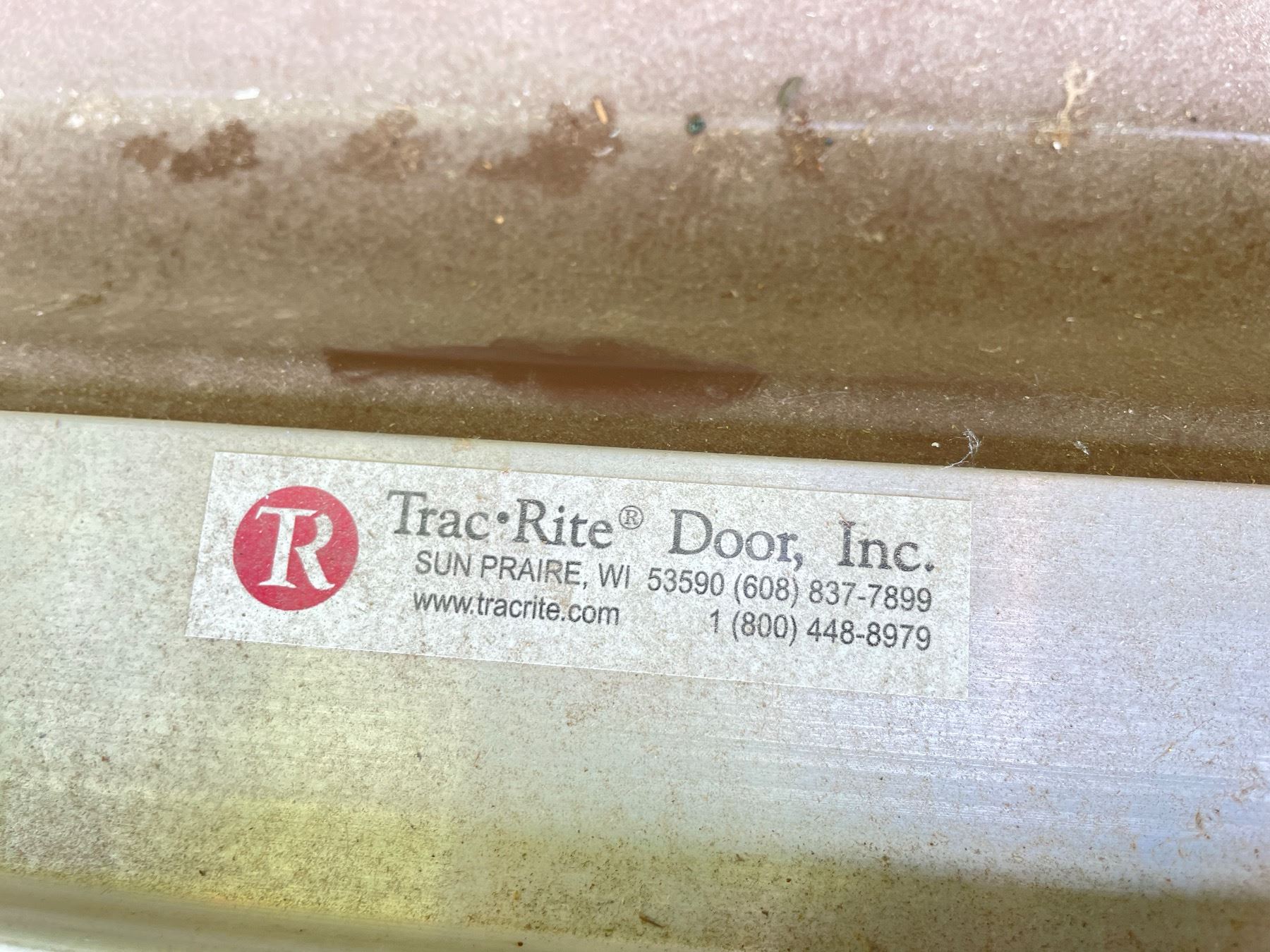 TRAC-RITE ROLLED UP GARAGE DOOR
