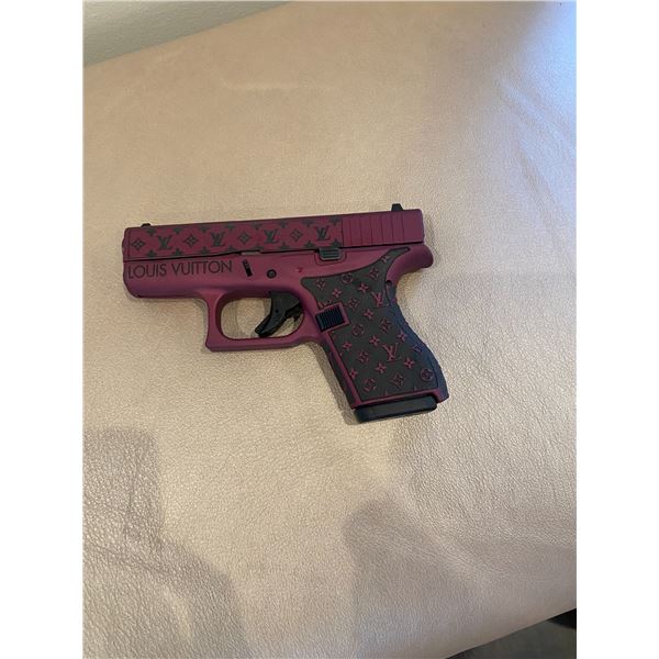 Glock 42 .380 auto with Louis Vuitton etching.  One-of-a-kind holster handcrafted by Pamela Frost Sh