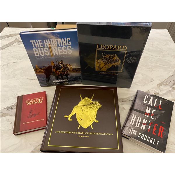 BOOKS:  The History of Safari Club International, signed by Steve Comus.  Leopard, by Craig Boddingt