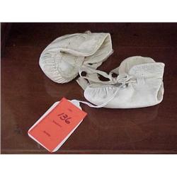 Old white leather baby booties