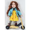 Image 1 : PORCELAIN DOLL RIDING WOODEN SCOOTER