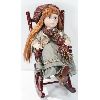 Image 1 : PORCELAIN DOLL ON A ROCKING CHAIR