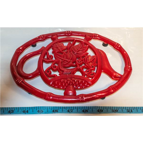 RED CAST IRON TRIVET